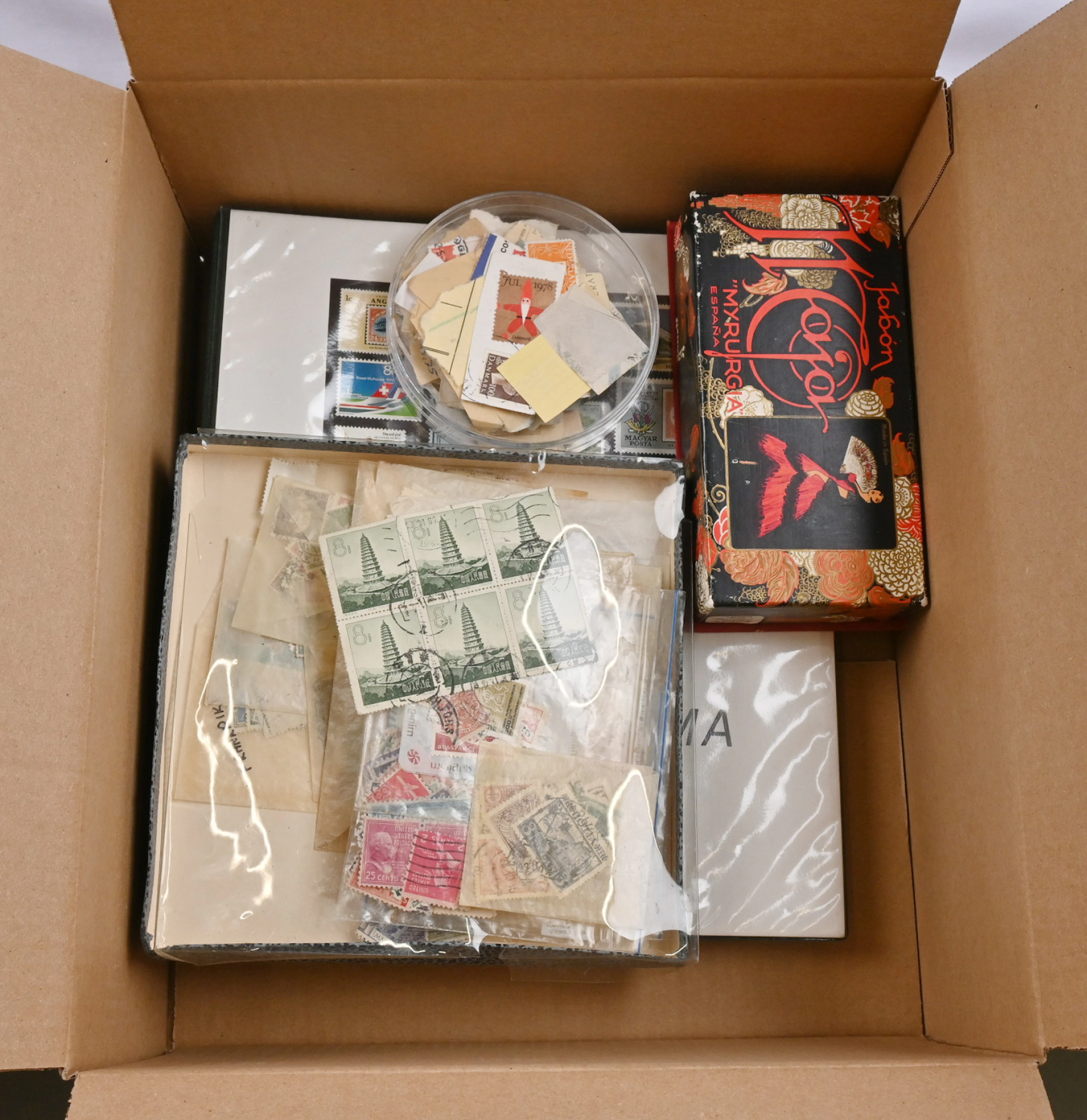 Worldwide, small selection of stamps in an album as well as a little