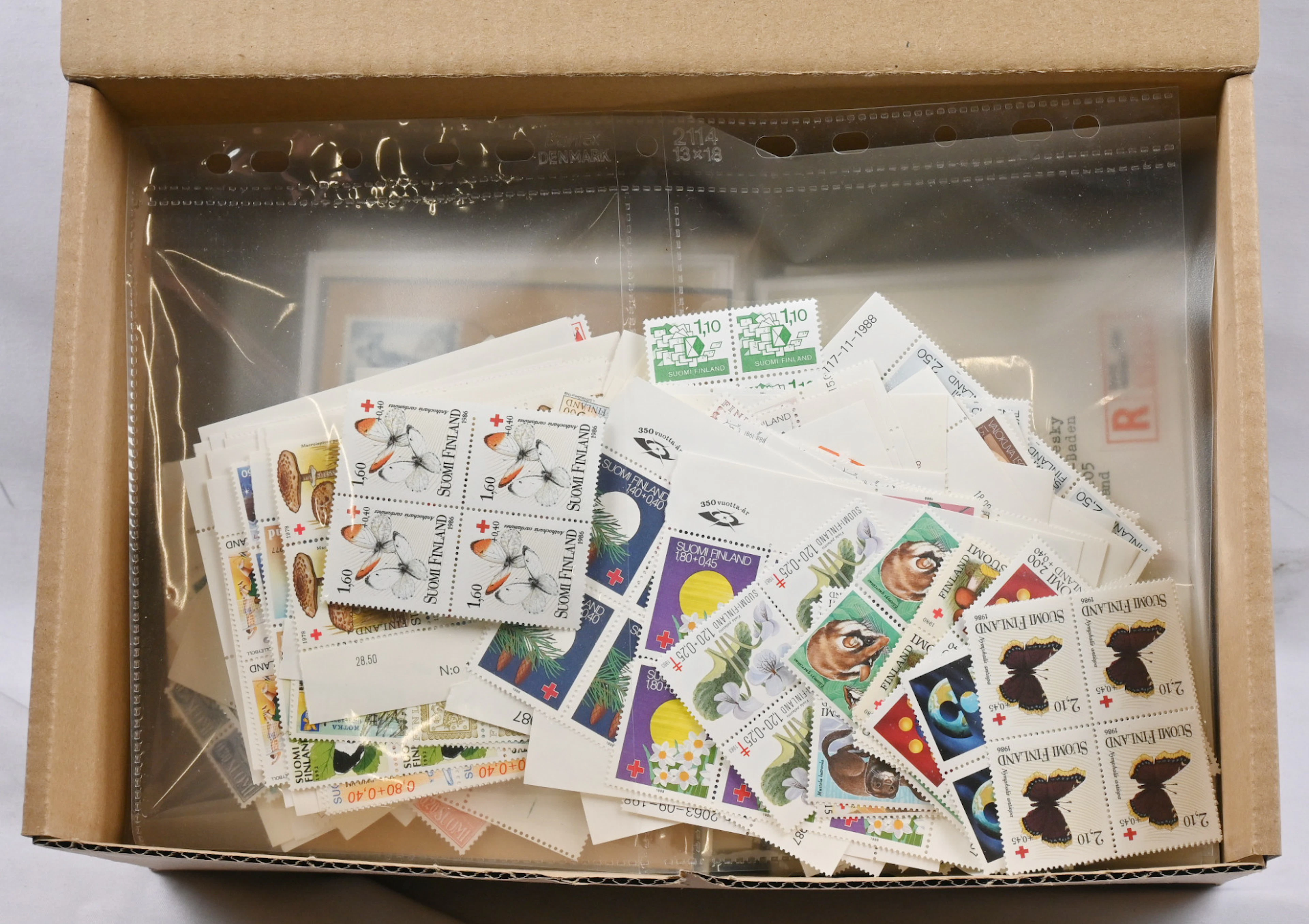 Box including stamps and postal items, eg. selected postal items from