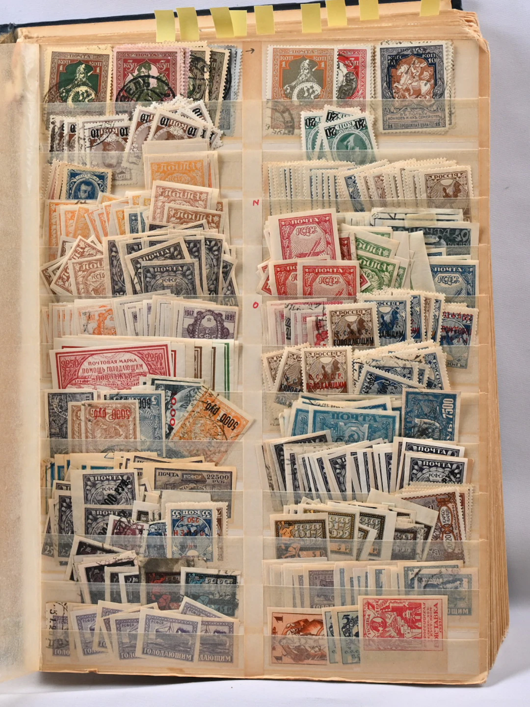 1914 - 1972 over-filled thich broken stockbook with plenty of used