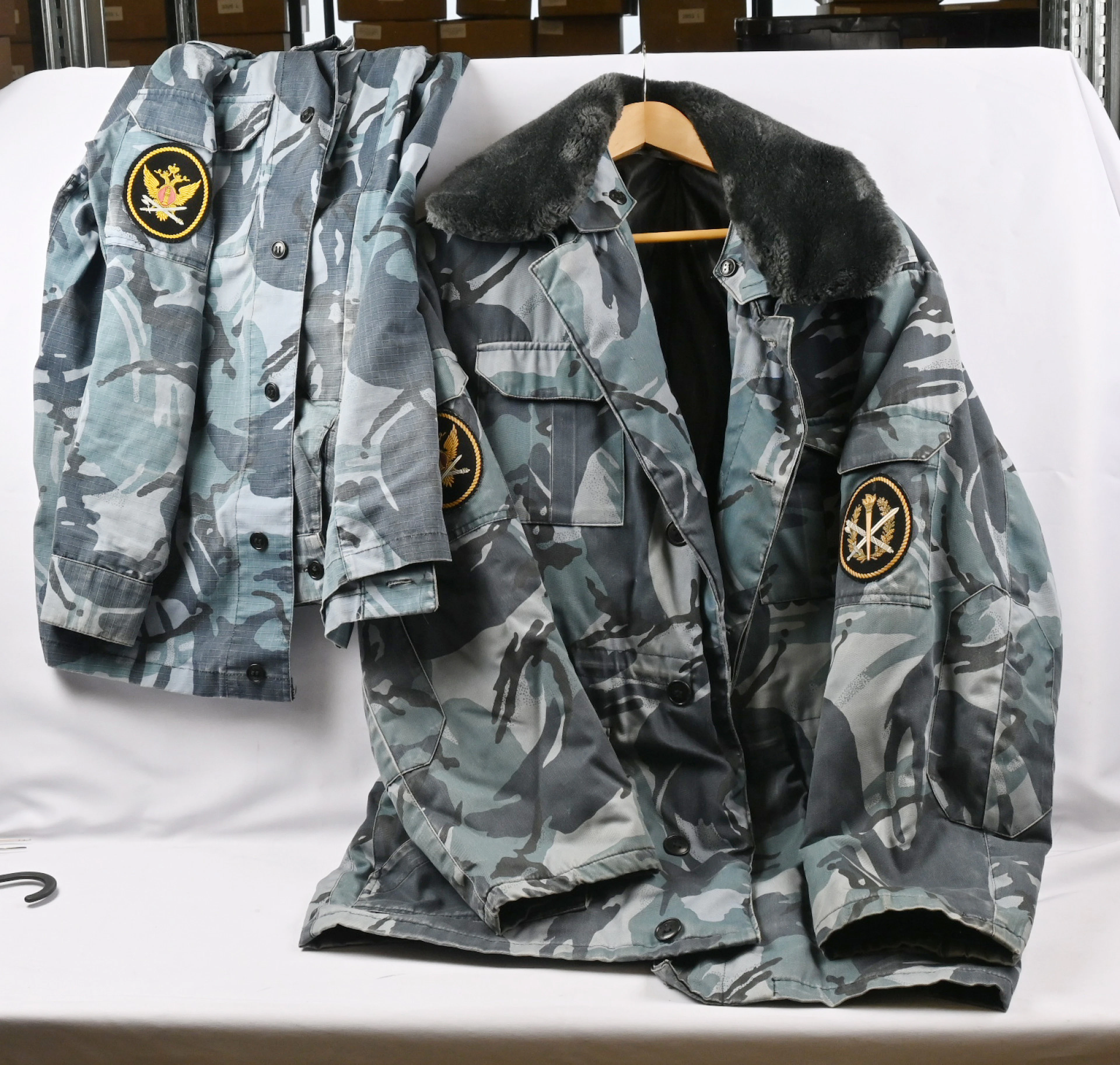 Camouflage jacket, trousers, shirt as well as an overcoat of a guard