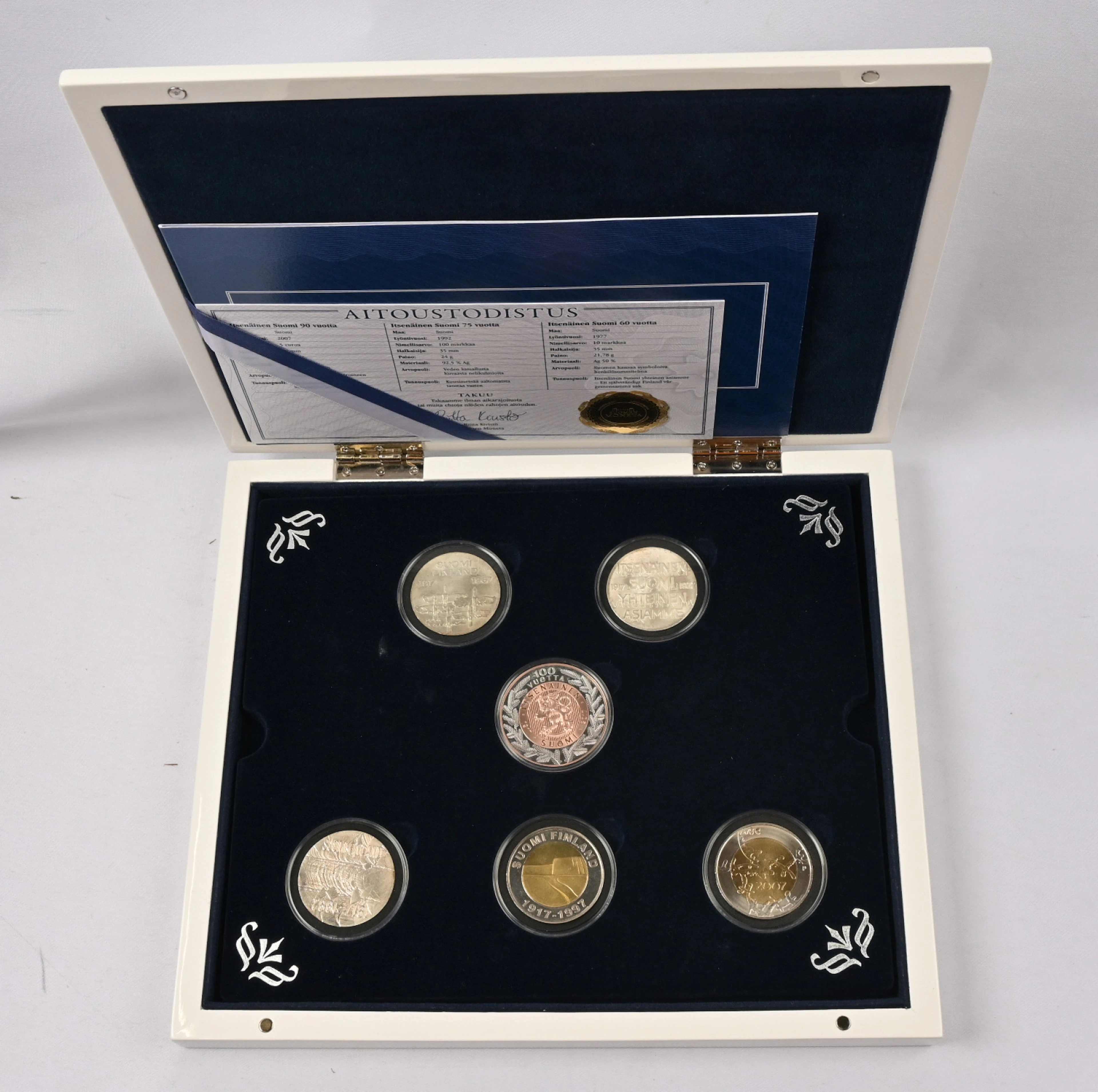 Moneta's Finland 100 years collection, eg. five different commemorative coins.