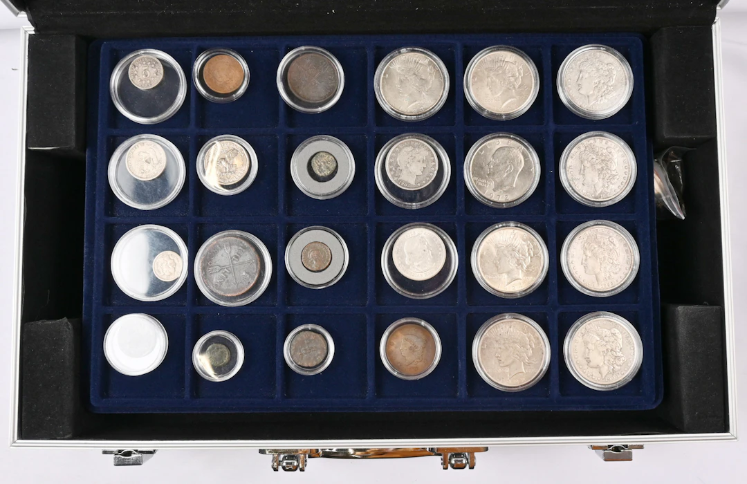 Worldwide selection of coins in a briefcase eg. silver coins from