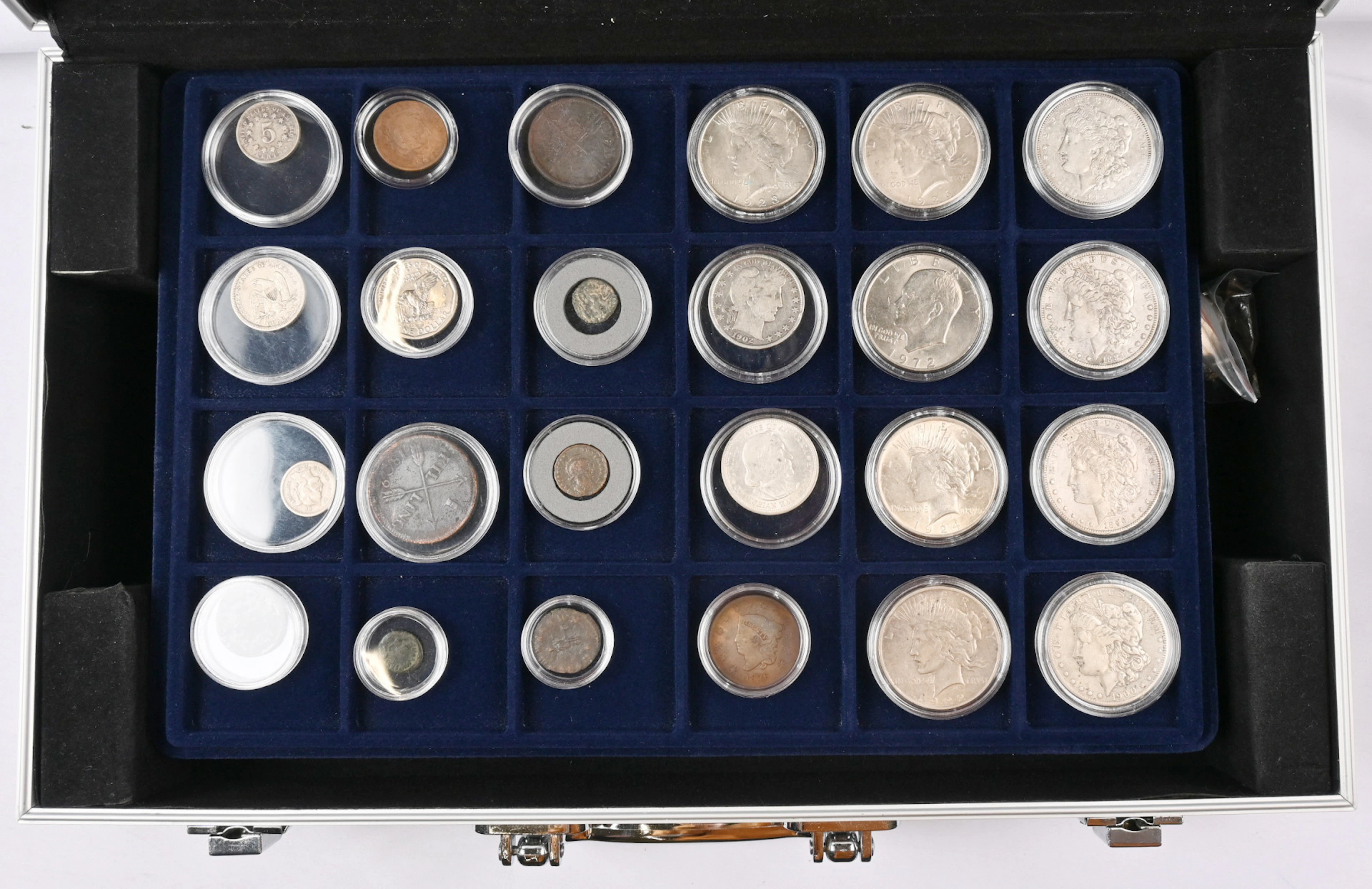 Worldwide selection of coins in a briefcase eg. silver coins from