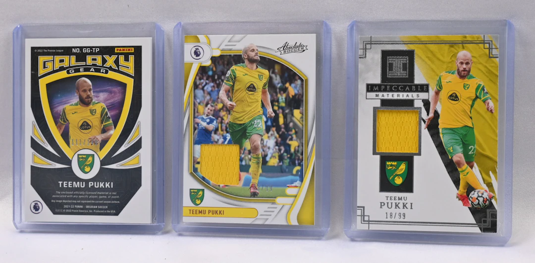 Teemu Pukki three jersey cards, Obsidian Galaxy /149, Impeccable /99