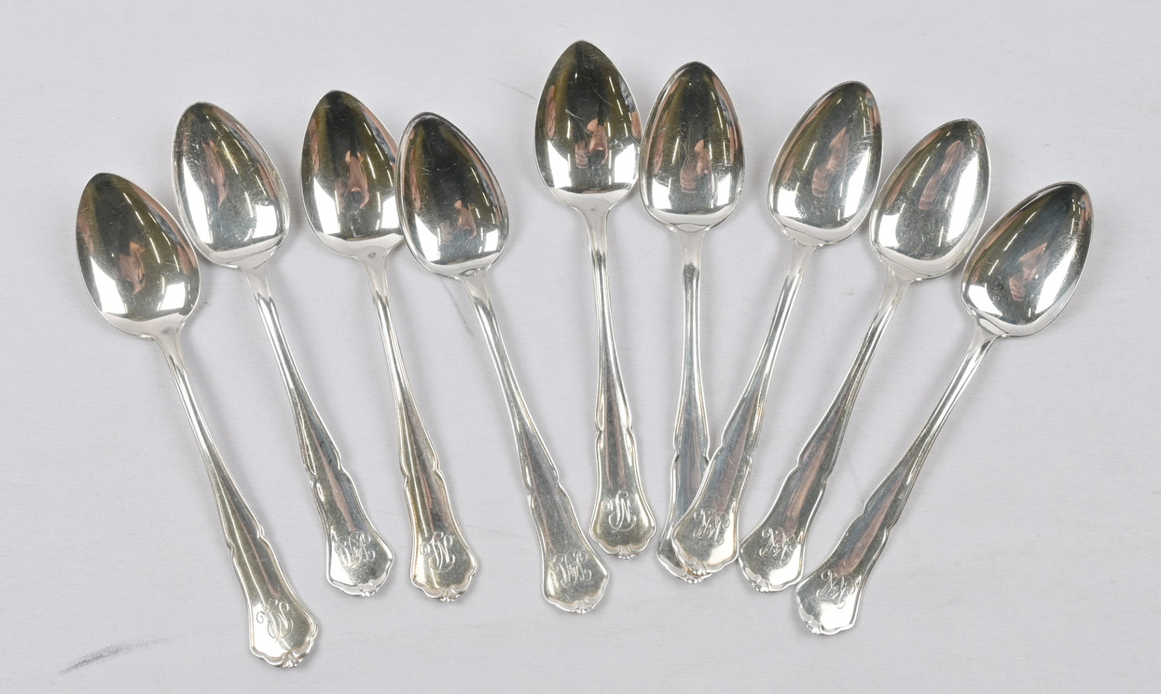 Chippendale coffee spoon, silver (830), nine pieces with engravings.