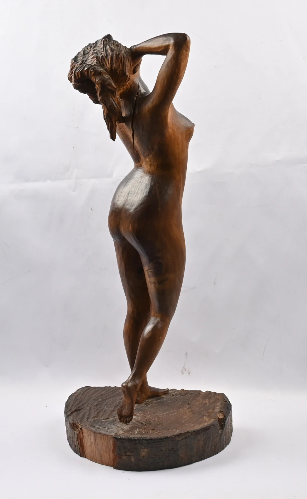 Woman-themed wooden sculpture. Height approximately 57 cm.