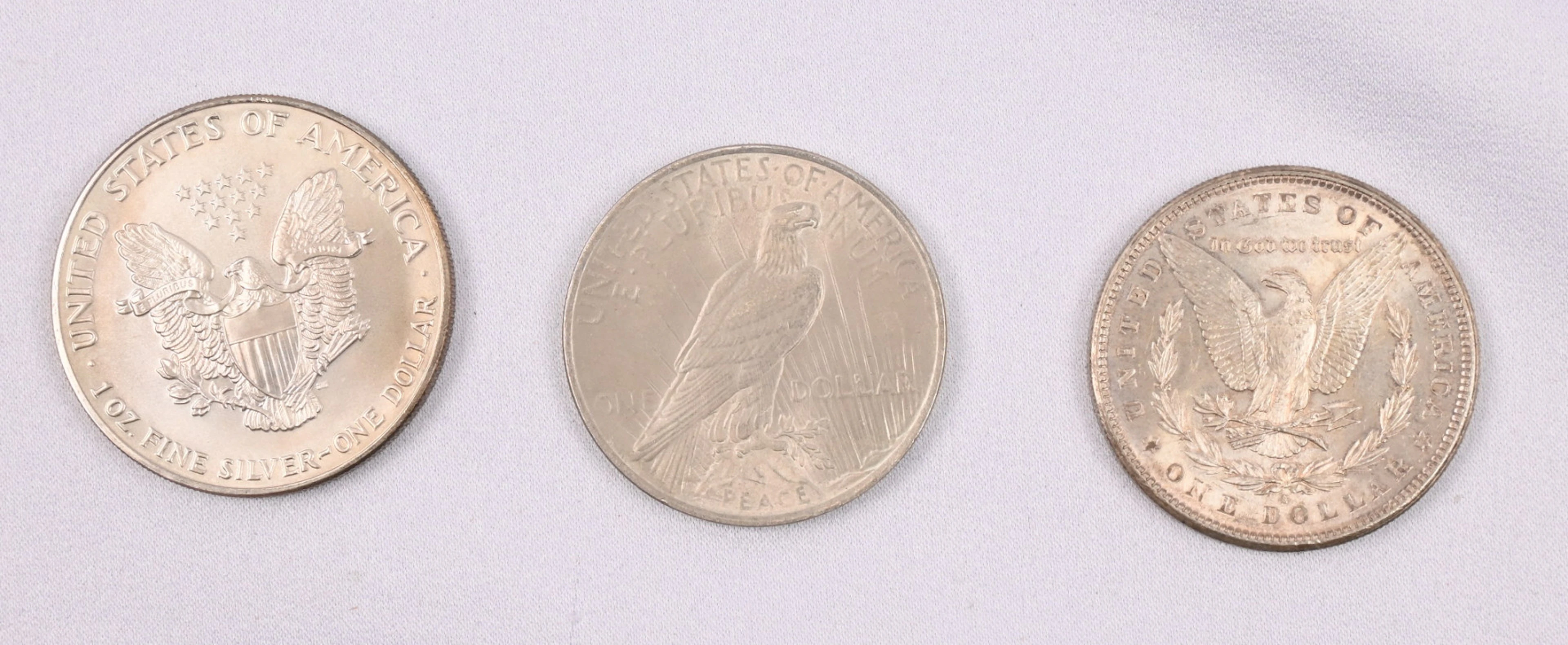 USA 1881, 1923 and 1990 1 dollar silver coins. Fine condition.