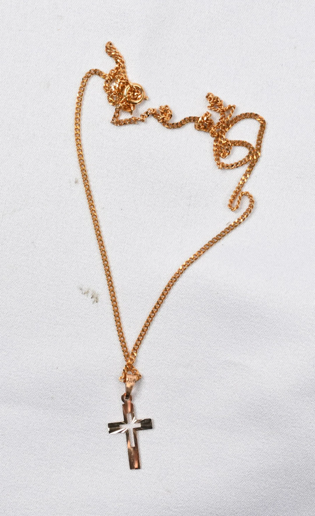 Cross, gold (14 k) weight approximately 0.4 g. Additionally gold-plated chain.