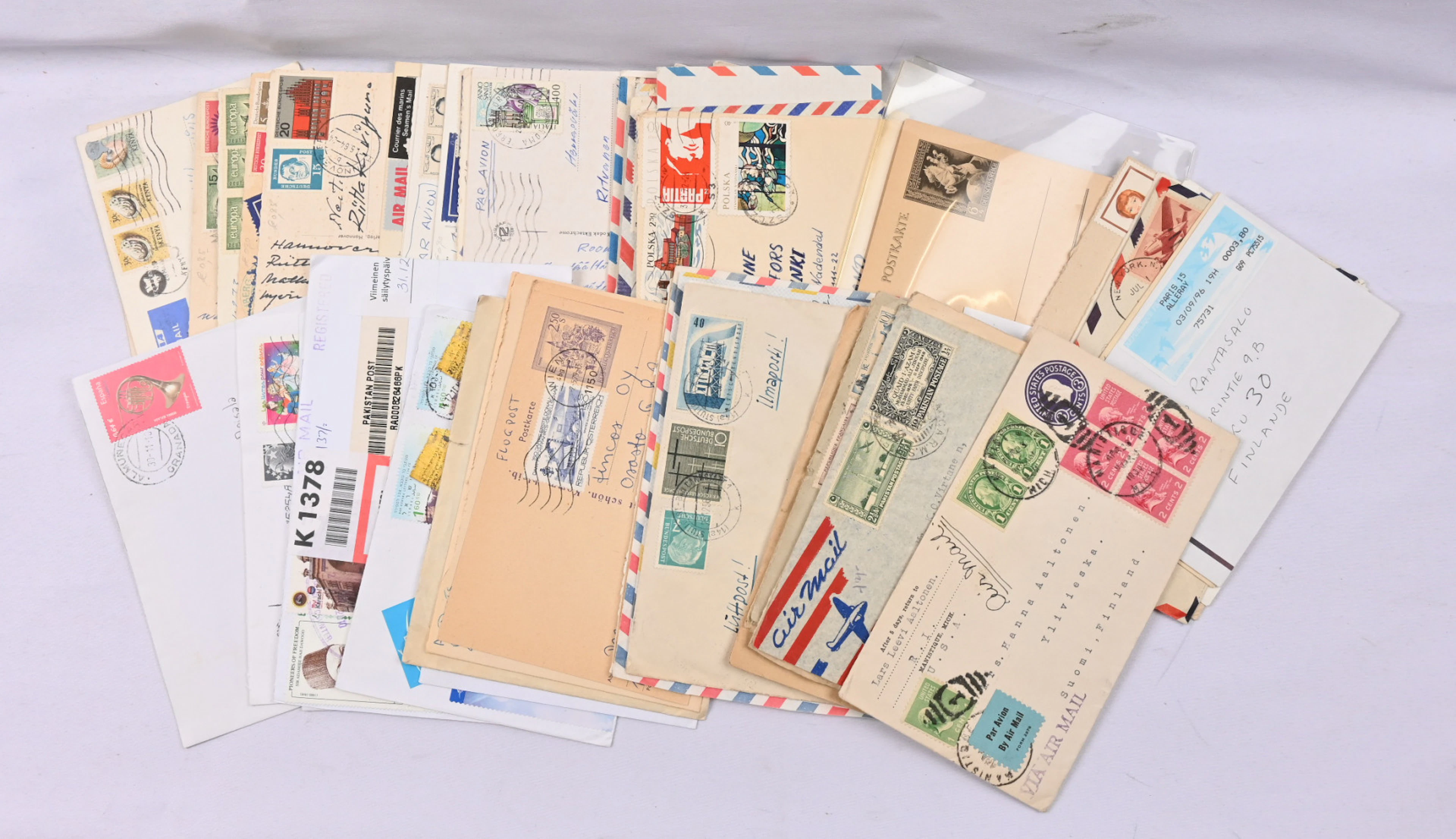 A bundle of postal items from different countries, plenty of airmail