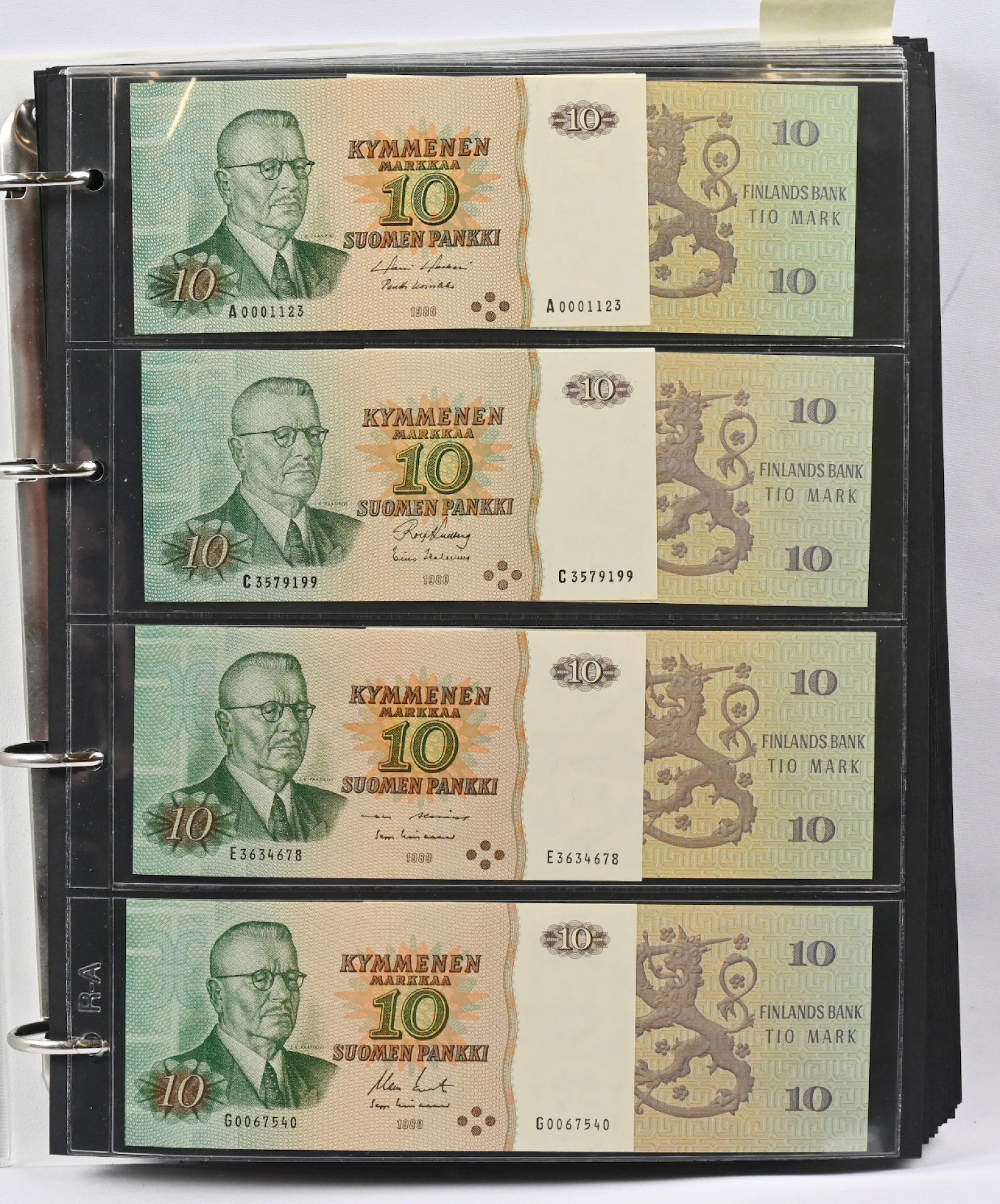 Banknote collection in an album. 1980 10 markka. All 27 series letters