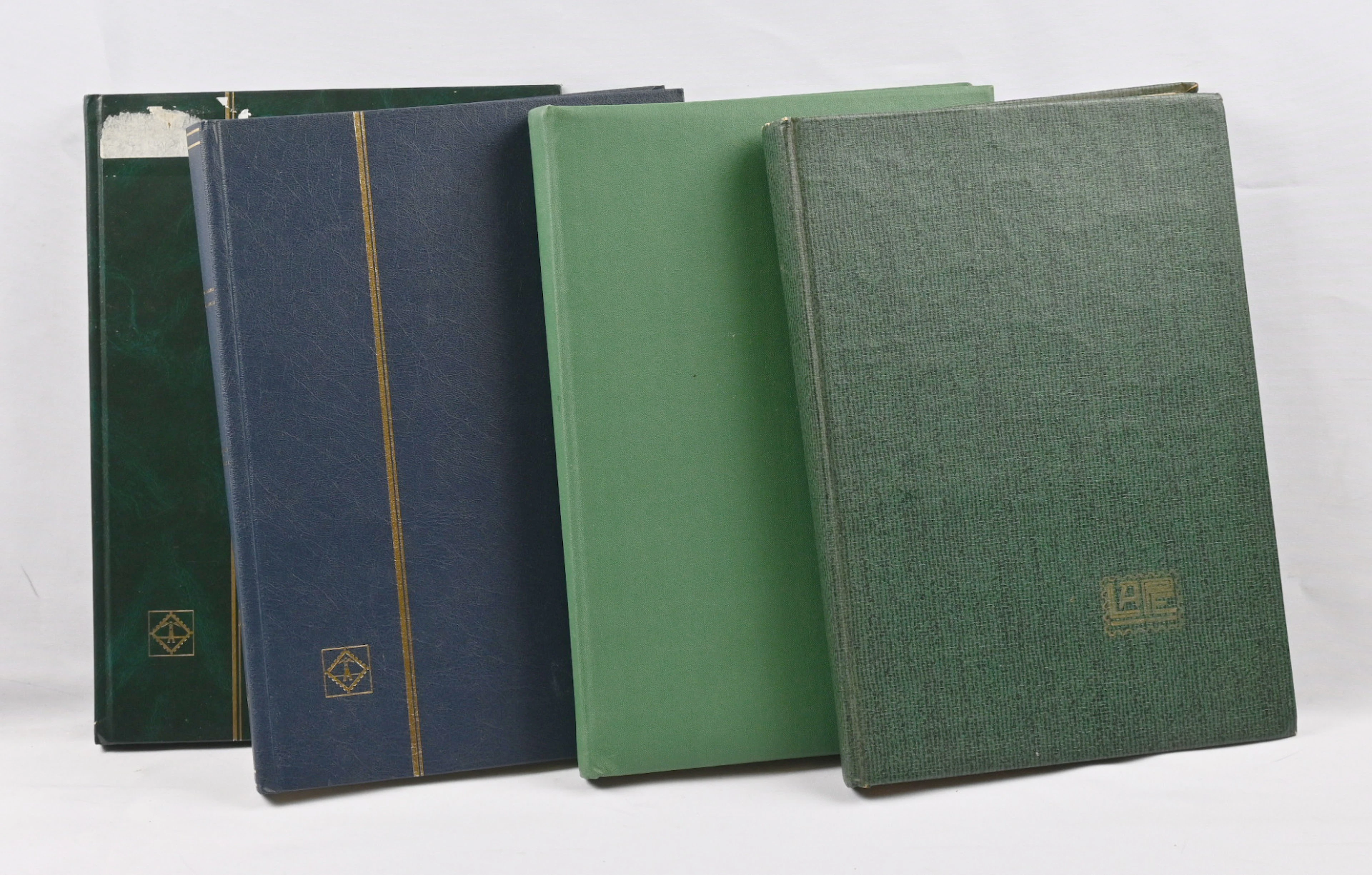 Stamps of different German areas in four stockbooks, mainly West Germany