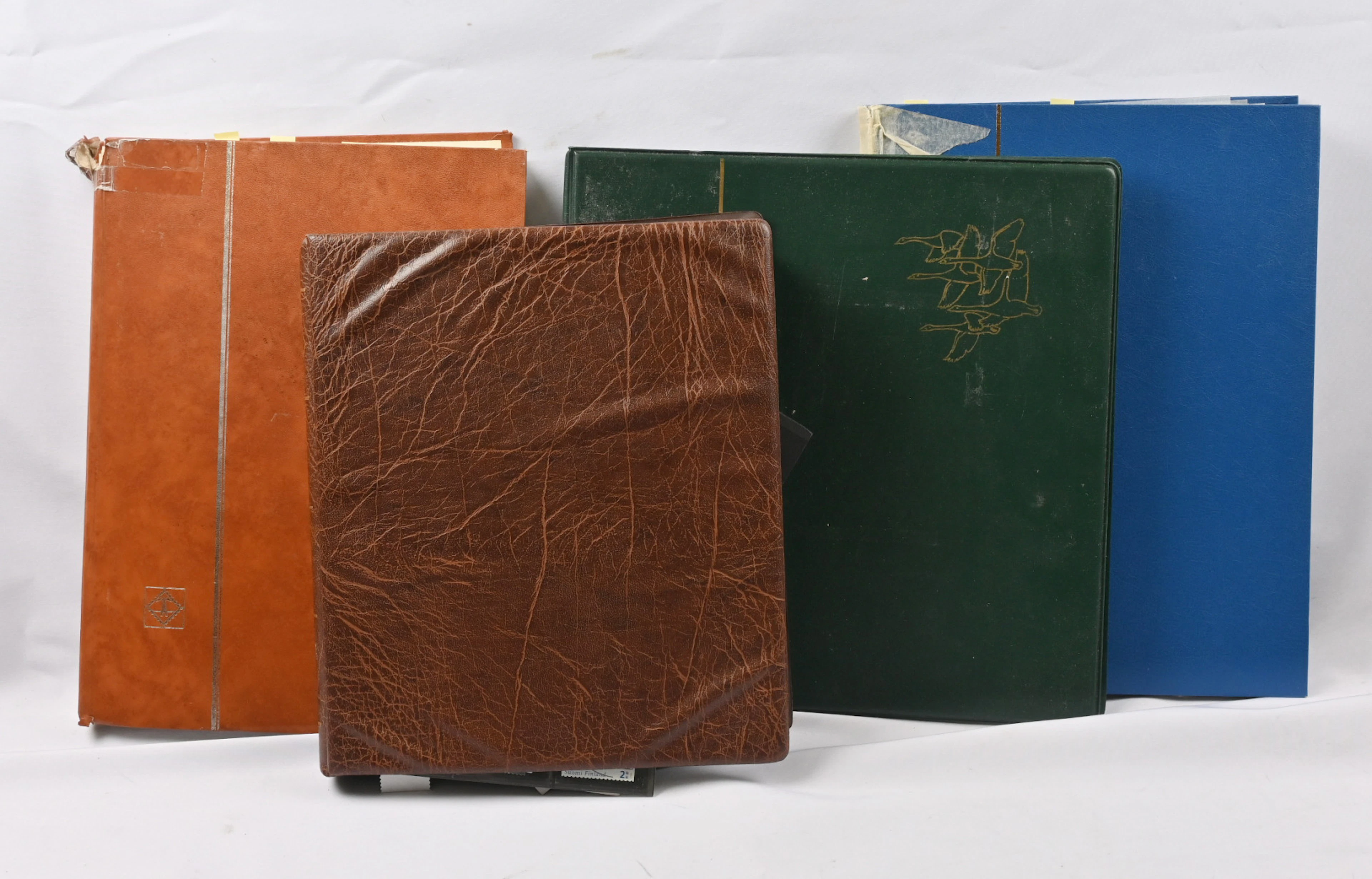 Interesting mixed stock material in four binders including eg. issue