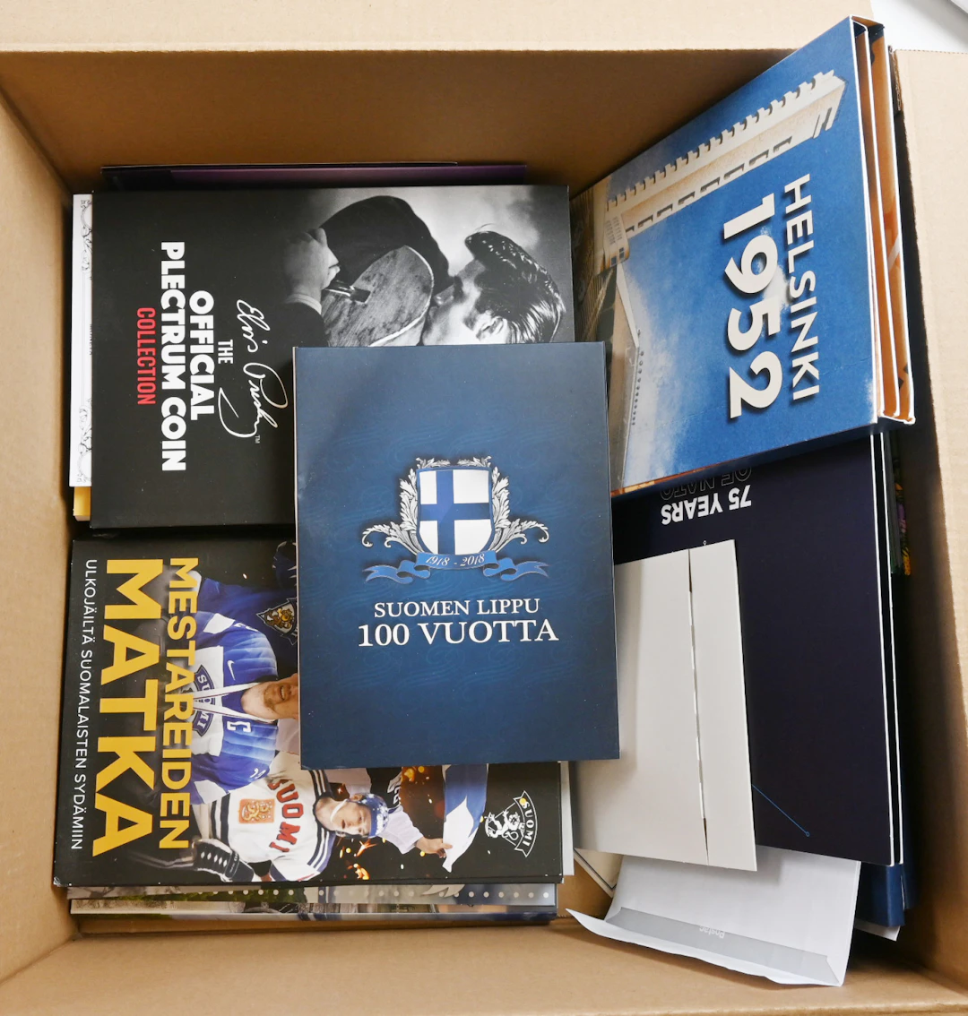 A box including Moneta's medal collection binders, usually with only