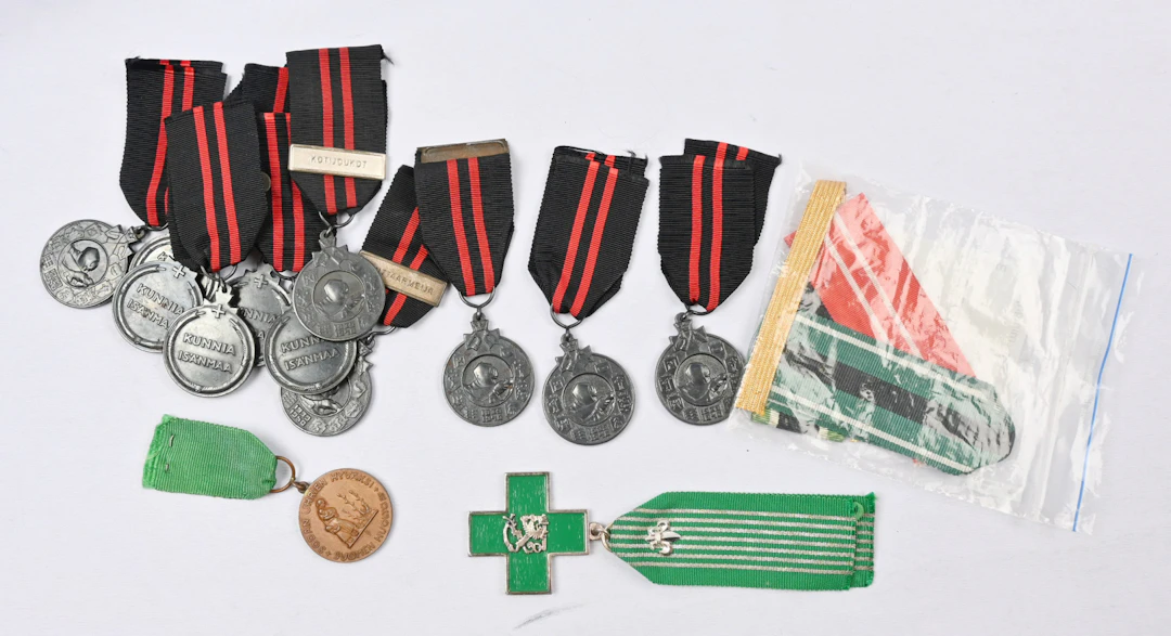 Selection of medals, ribbons of merit badges and The Volunteer Cross