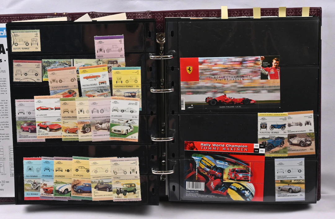 Cars, motorcycles, working machines etc., collection in an album.
