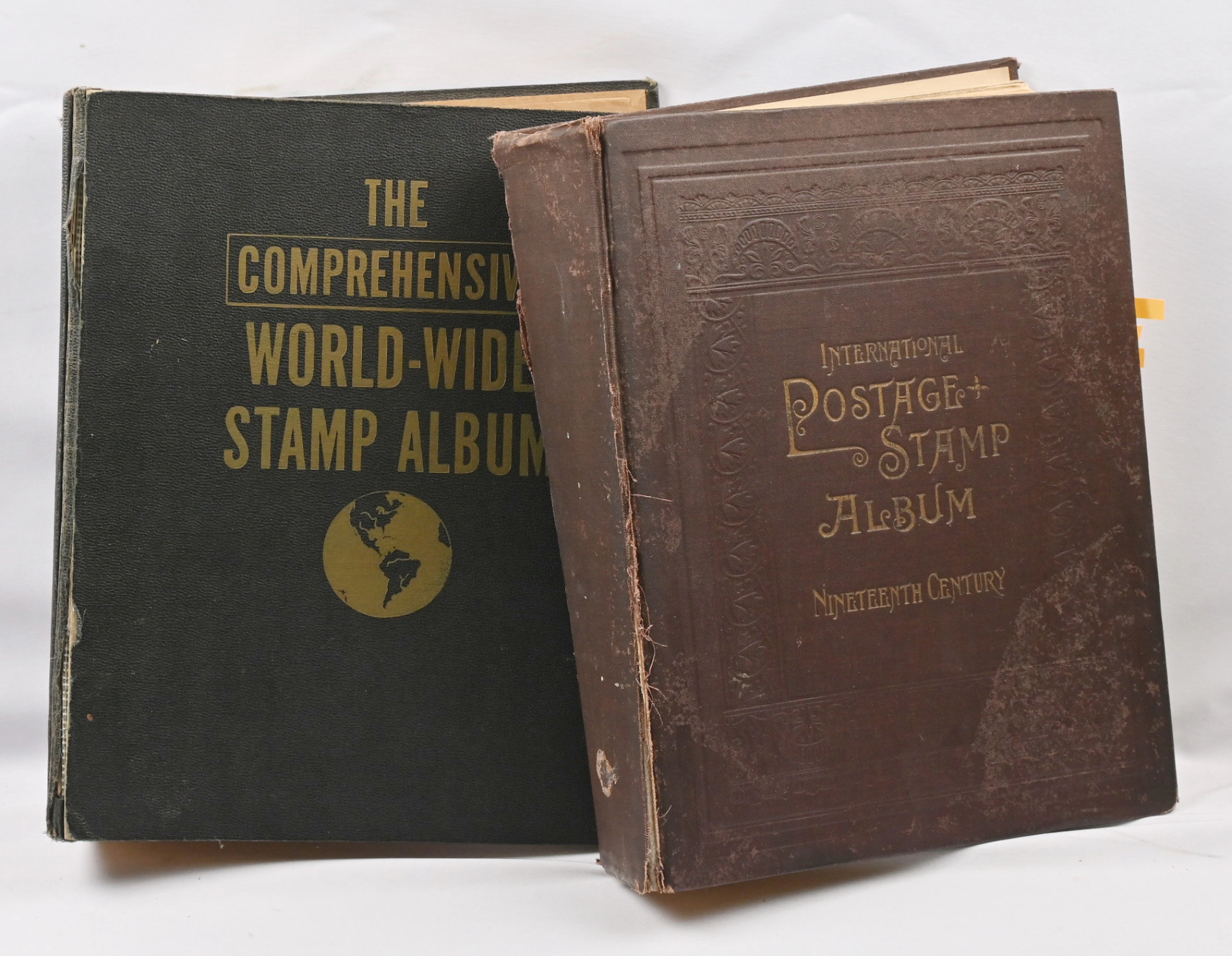 Two thick old worldwide albums. In the other only 1800s stamps, in
