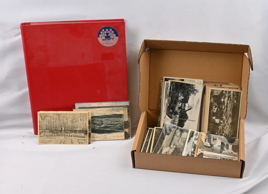 Mixed selection of topographical cards in an album and in a small