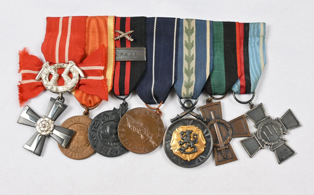 Medal bar, with seven merit badges. including eg. 8th Division Cross