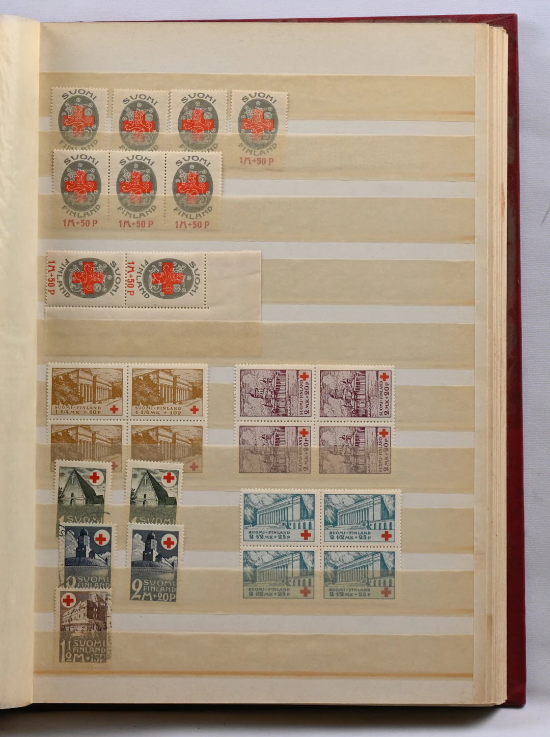 Red Cross and tuberculosis stamps stock selection in a stockbook.