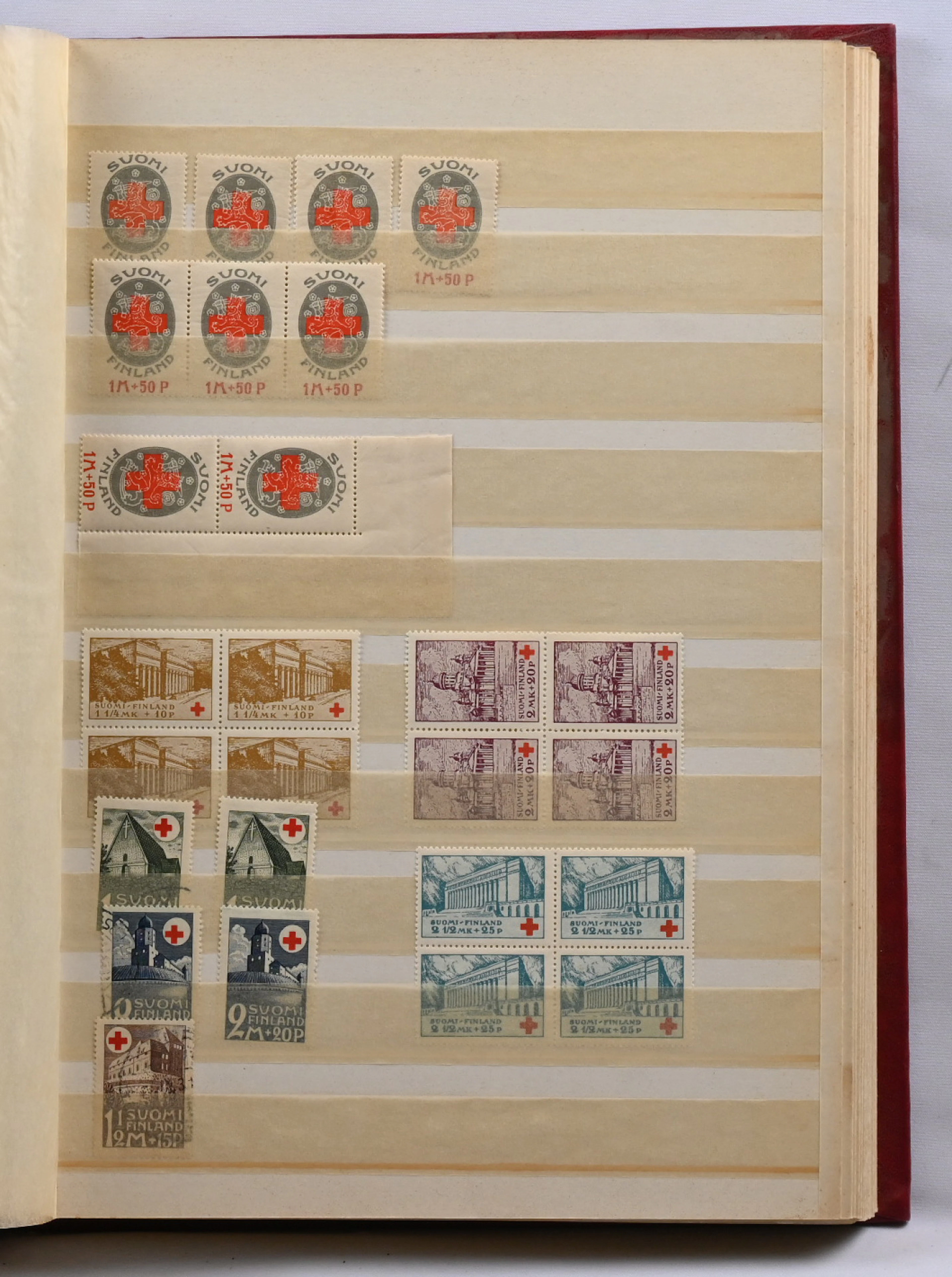 Red Cross and tuberculosis stamps stock selection in a stockbook.