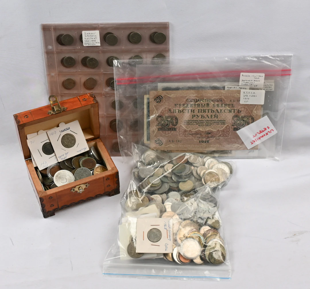 Selection of foreign coins and banknotes. including eg. German old