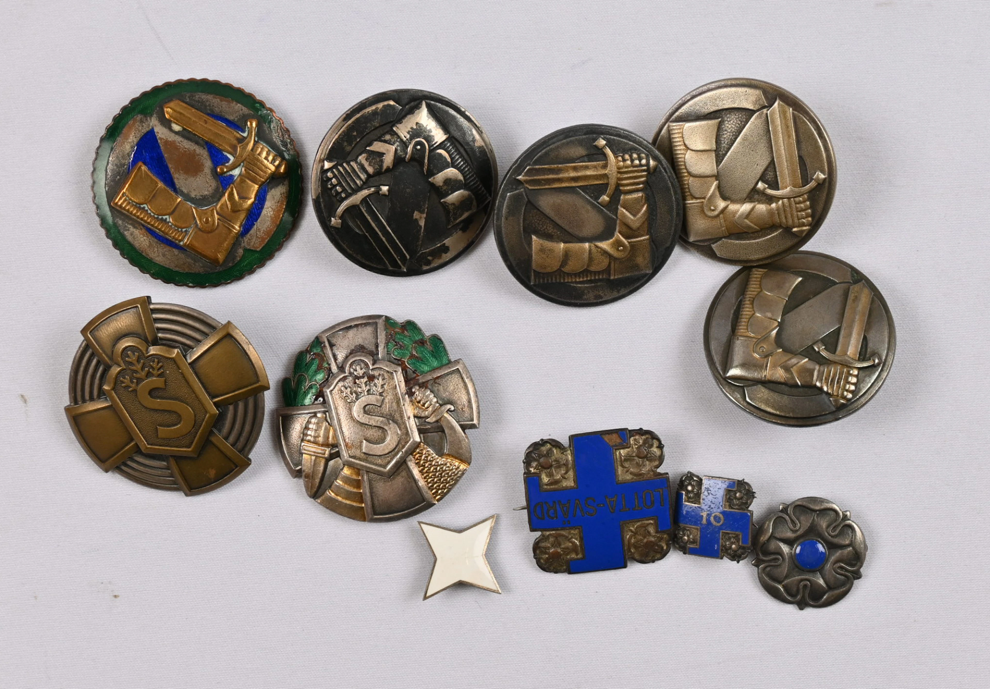 Selection of Civil Guard hobby and fitness badges, as well as four