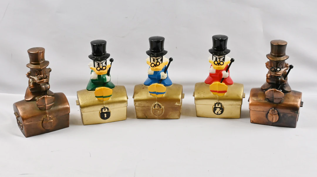 Scrooge McDuck money boxes, five different variants, including a copper one.
