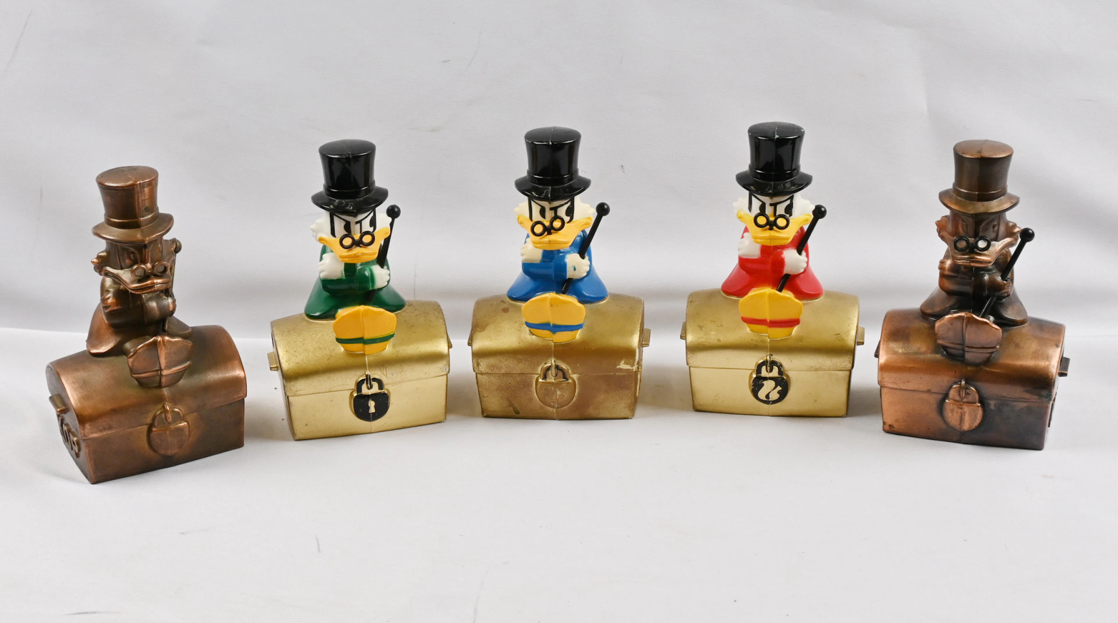 Scrooge McDuck money boxes, five different variants, including a copper one.