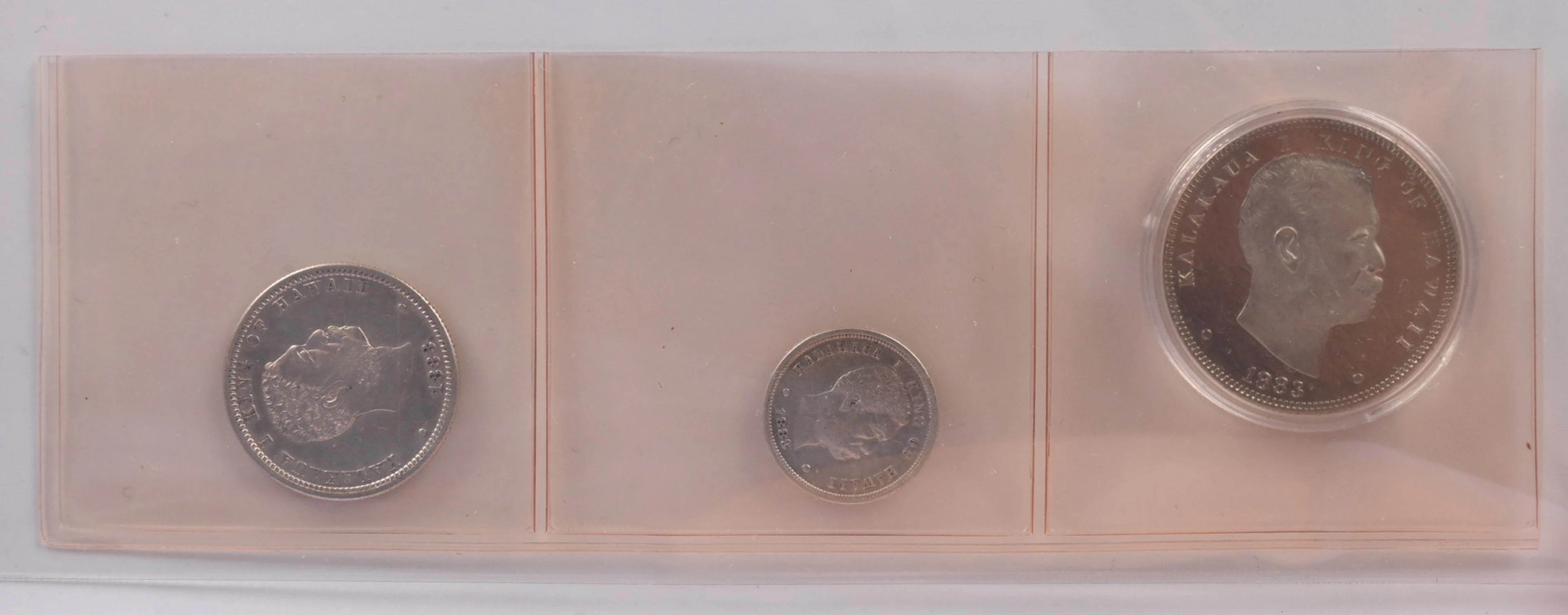Hawaii 1883 ¼ Dollar and 10 Cents silver, in fine condition. Additionally