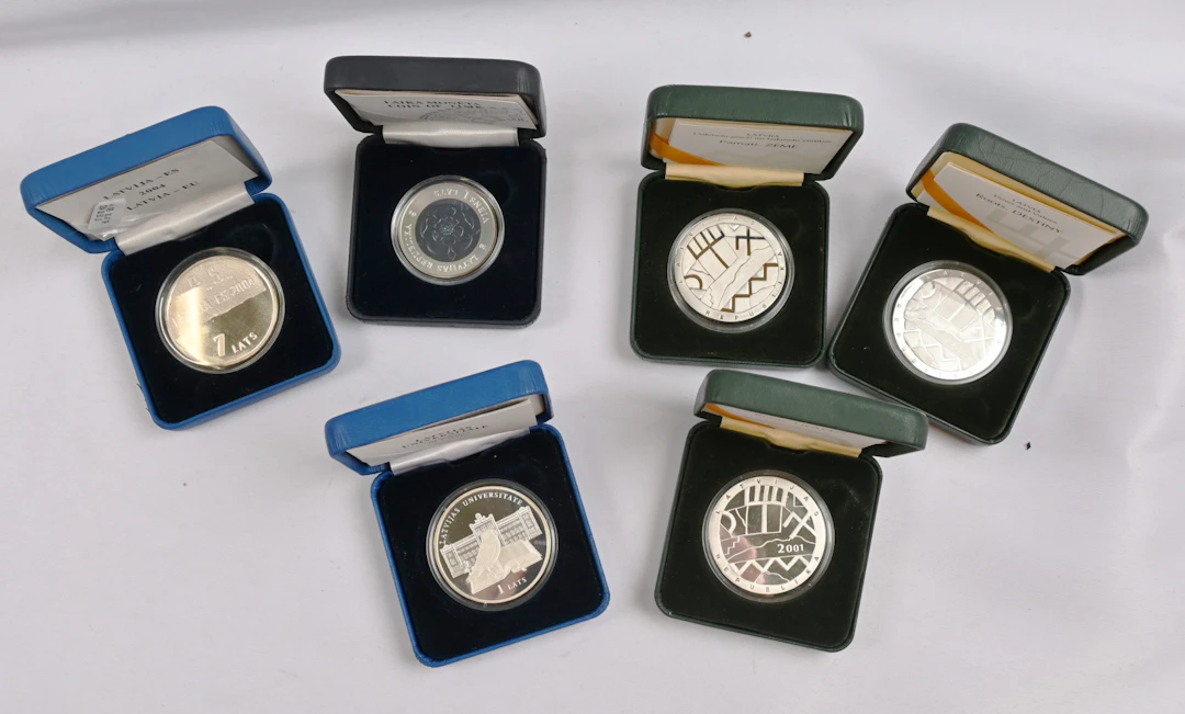 Latvia 1993 and 1996 10 Latu silver and 1999 - 2010 1 Lats 10 different.