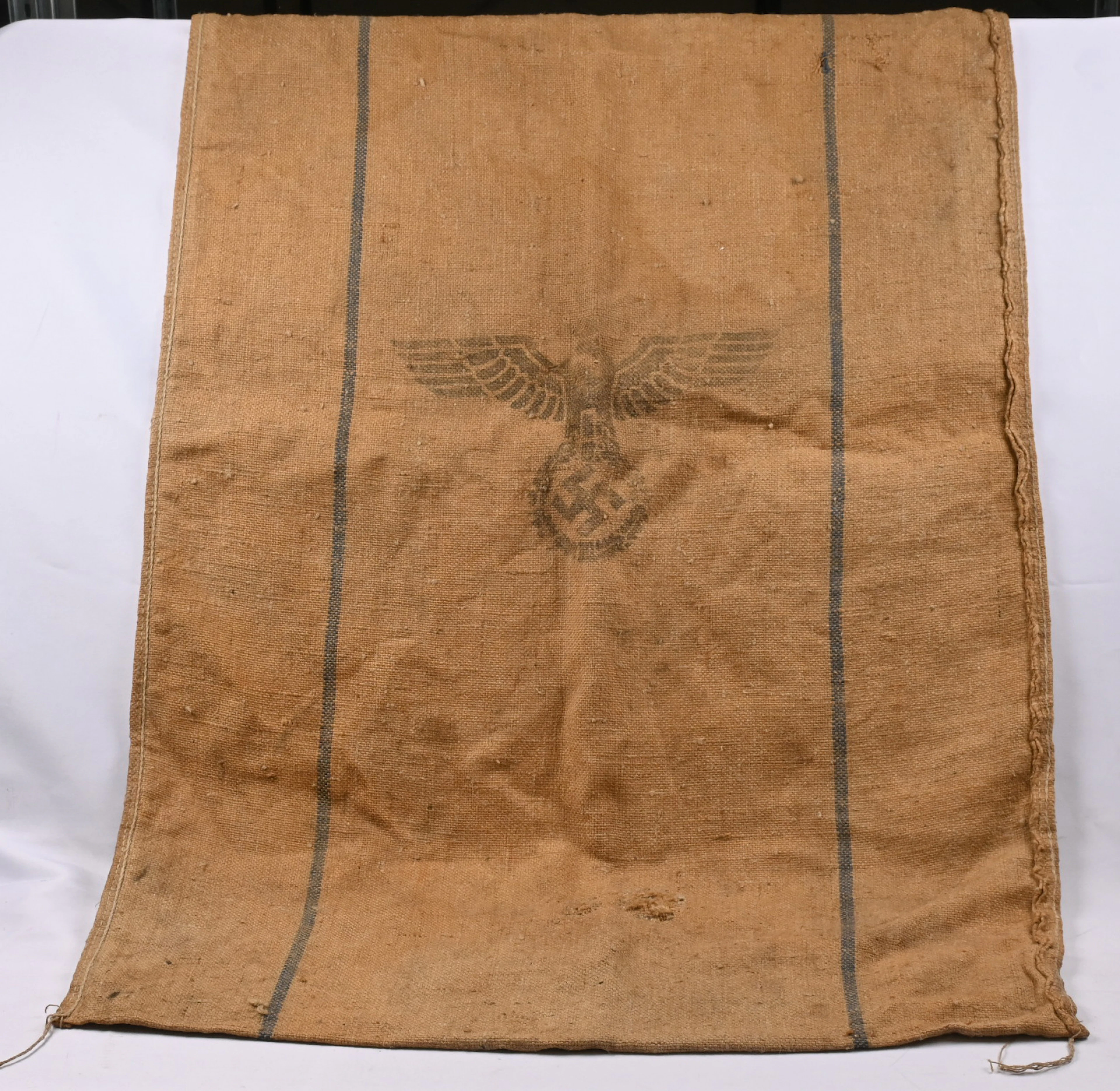 Old sack with German army insignia. Additionally a selection of photographs