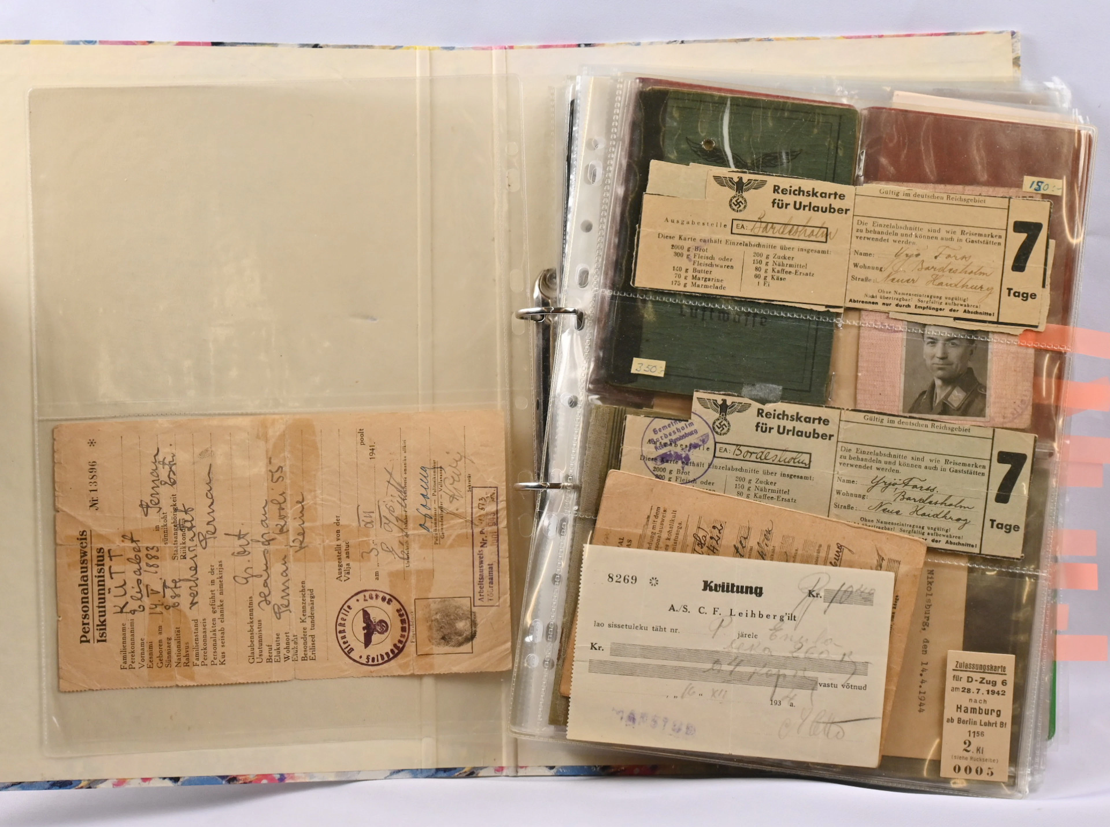 German war-time documents in an album, an excellent selection. Passports