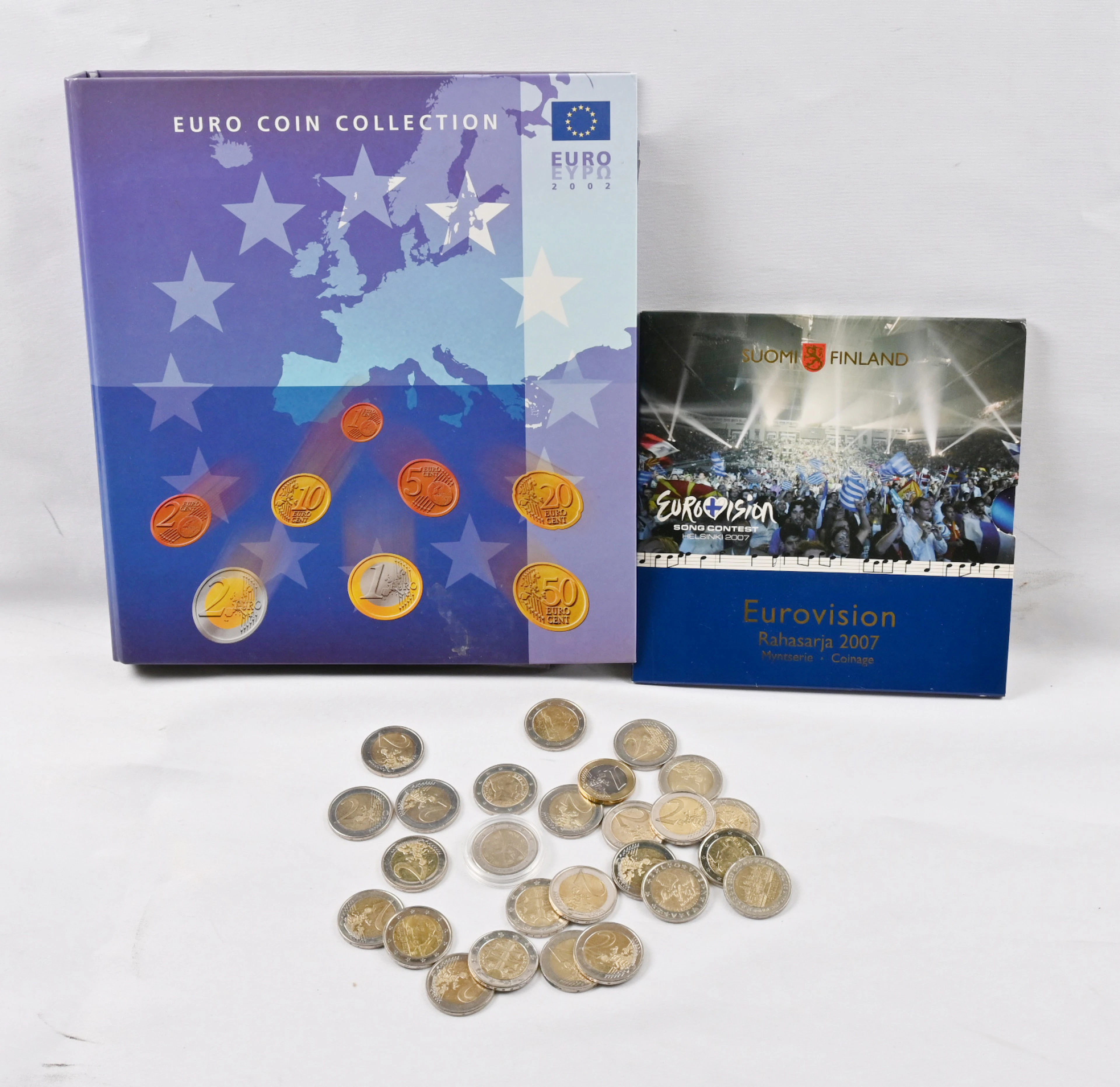Euro sets in an album, additionally over 20 pieces of 2€ coins including