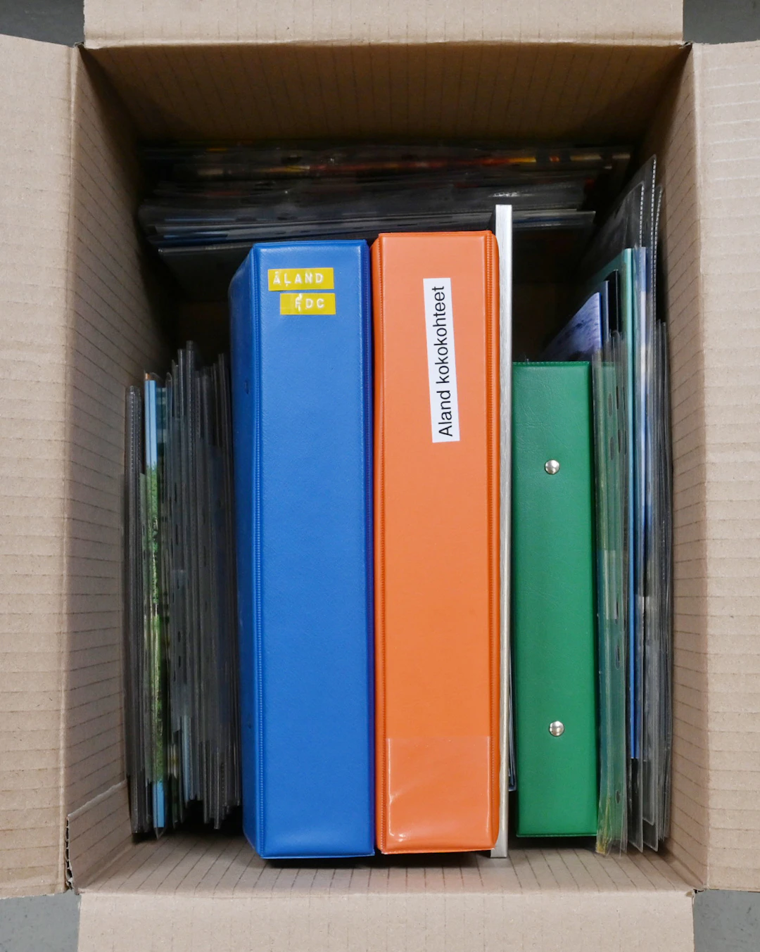 Box including selection of Finland and Aland Island year sets, first