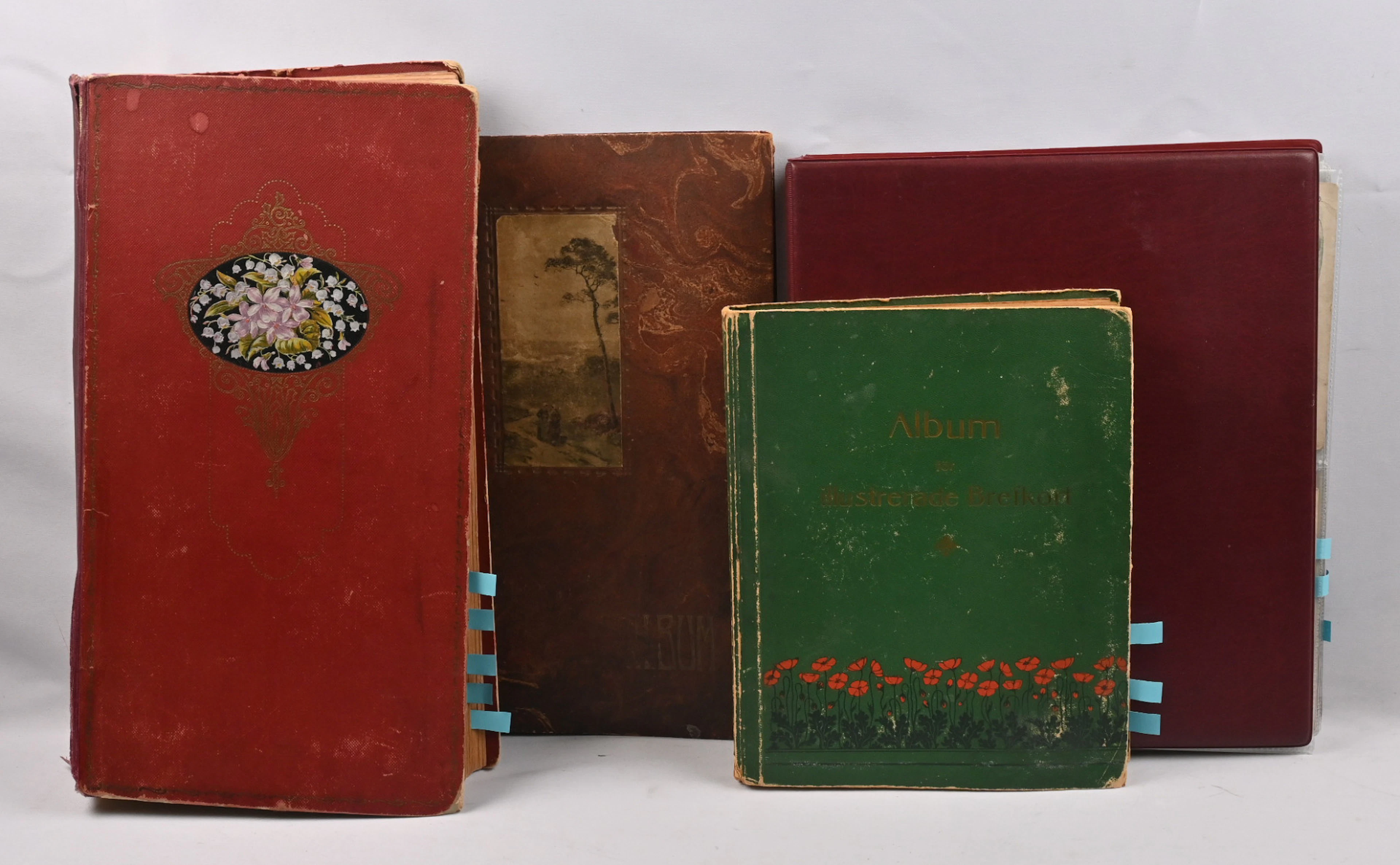 Old cards from the early 1900s in four old albums. Over 400 cards
