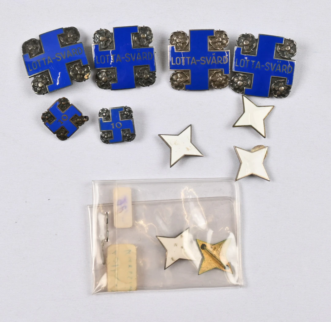 Selection of badges of the Lotta Svärd organization eg. Lotta badges
