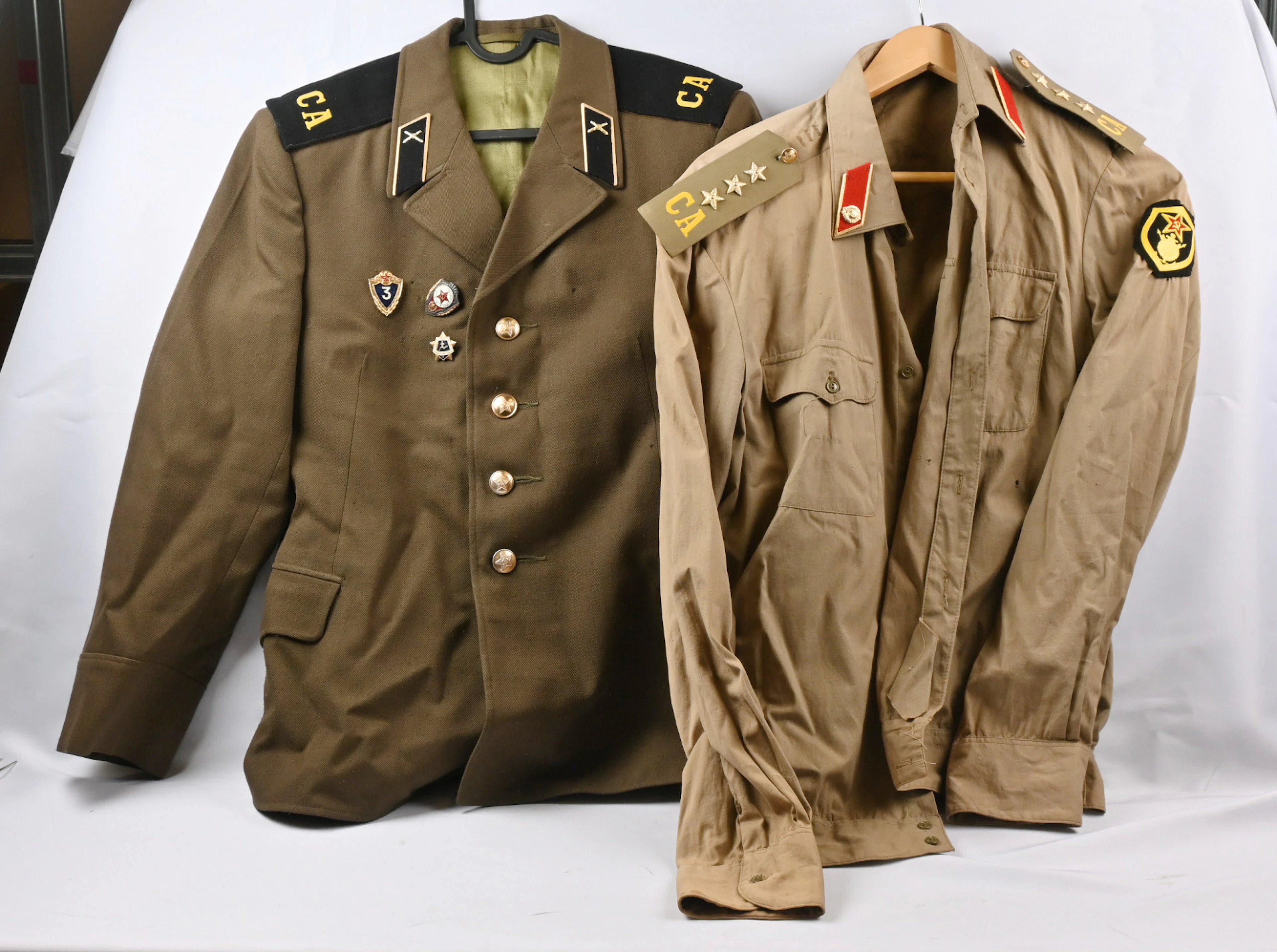Selection of Soviet Union era conscript uniforms. Three jackets, two
