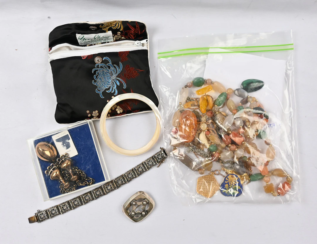 Jewelry selection including eg. Sarpaneva bracelet, Jorma Laine bronze
