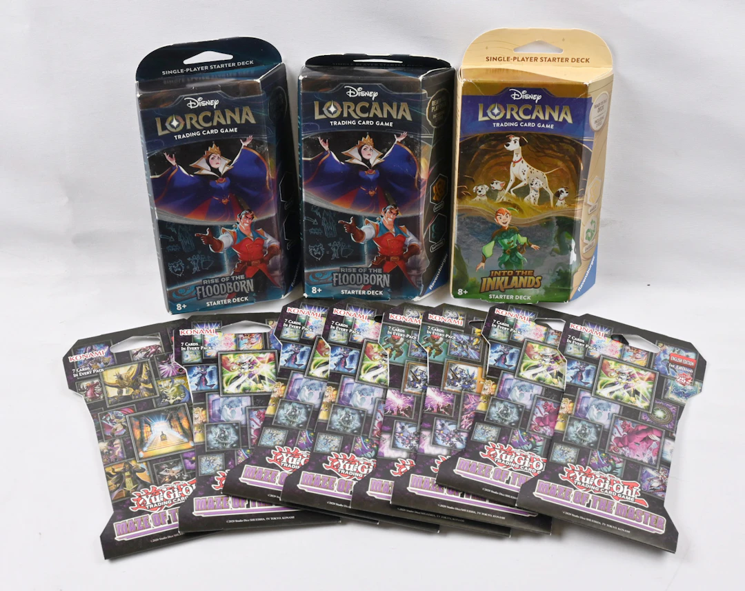 Yugioh sleeved booster eight pieces and Lorcana starter three pieces