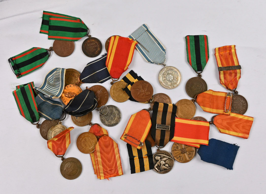 Selection of Finnish merit badges and medals. In total 24 pieces.