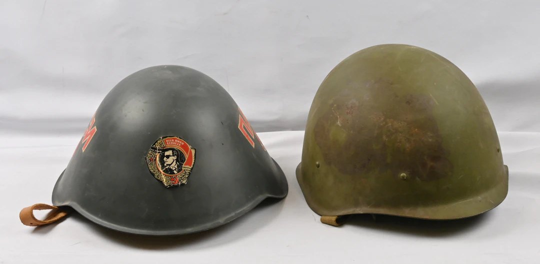 Two military helmets. First is from the East Germany period, with
