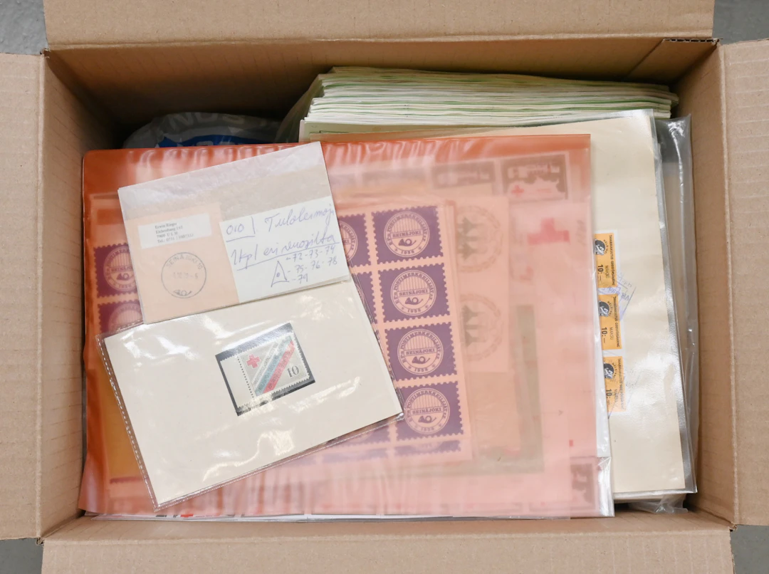 Old sales items and stock material in bags, also some postal items