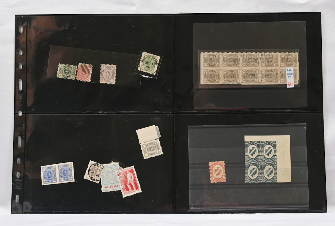 Mixed selection on pages and on stockcards, including 1889 25 penni