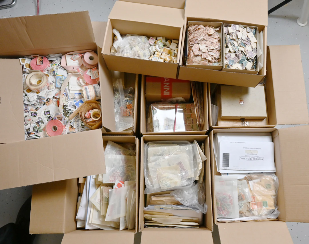 Worldwide loose bulk stamps in nine boxes over 27 KG!