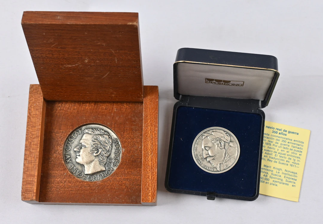 Two Swedish silver medals, Vasa ship 350 years (certificate) and Carl