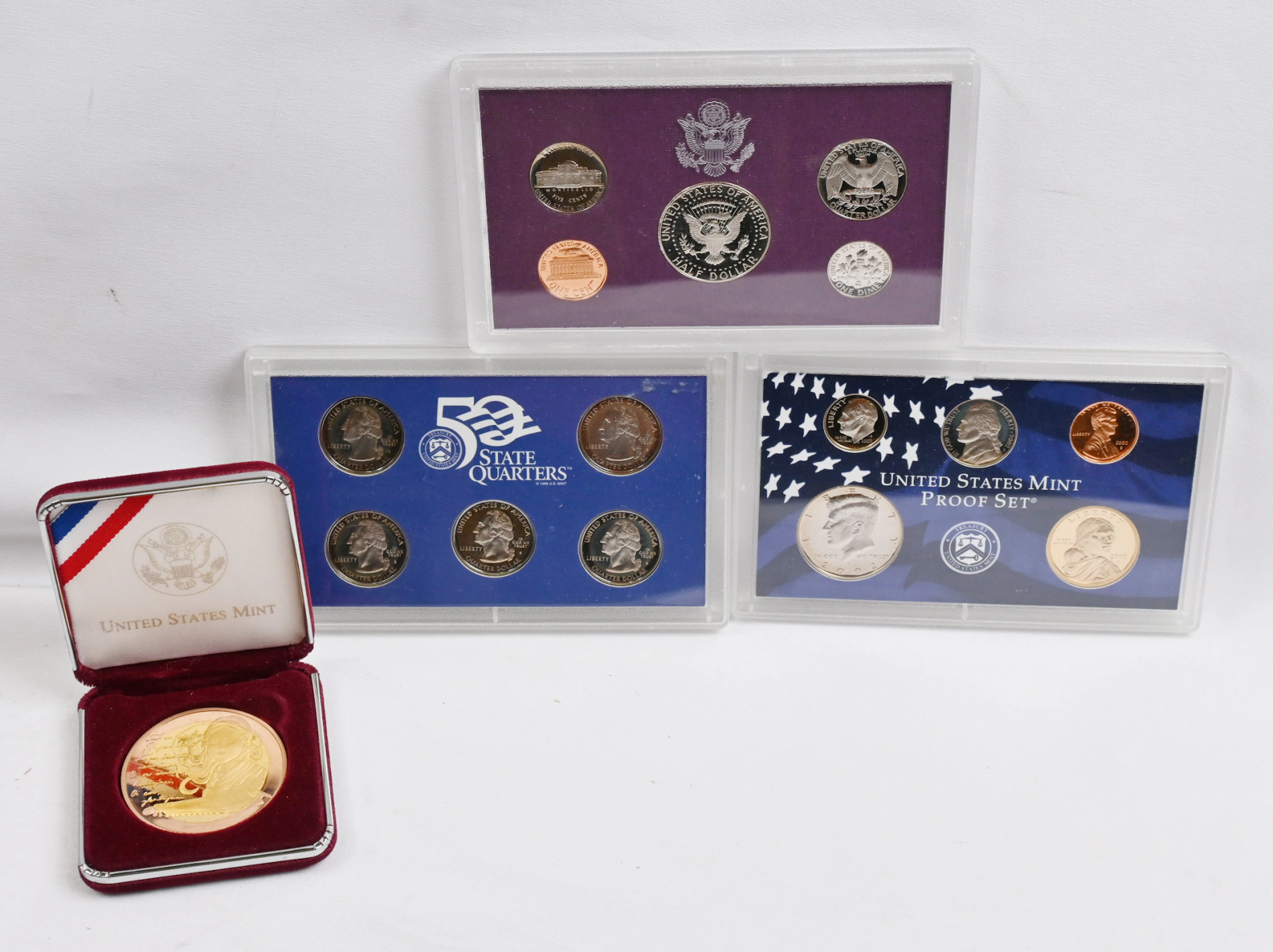 Foreign medals and coins, eg. Elvis theme etc. Including also coloured