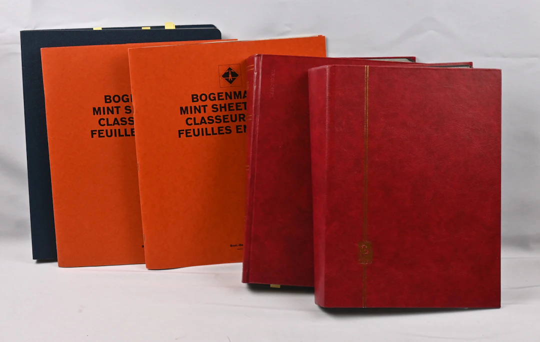 Old selection of complete sheets, sheet parts and stamps in two stockbooks