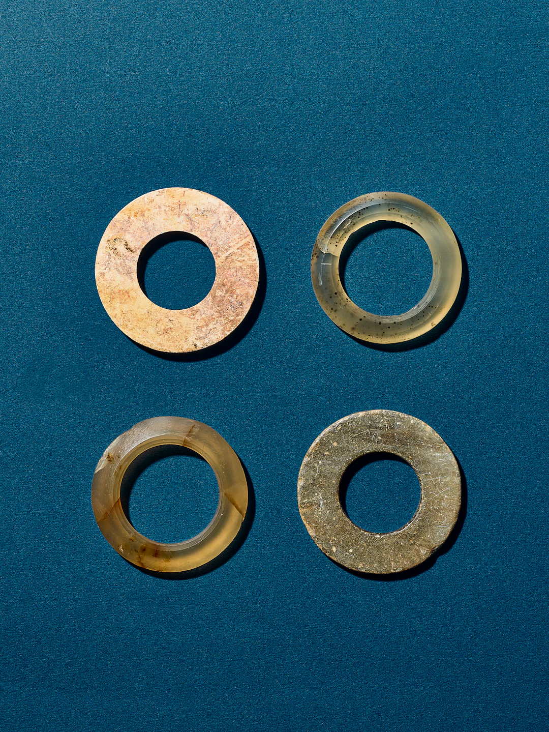 A Group of Two Jade Rings and Two Agate Rings