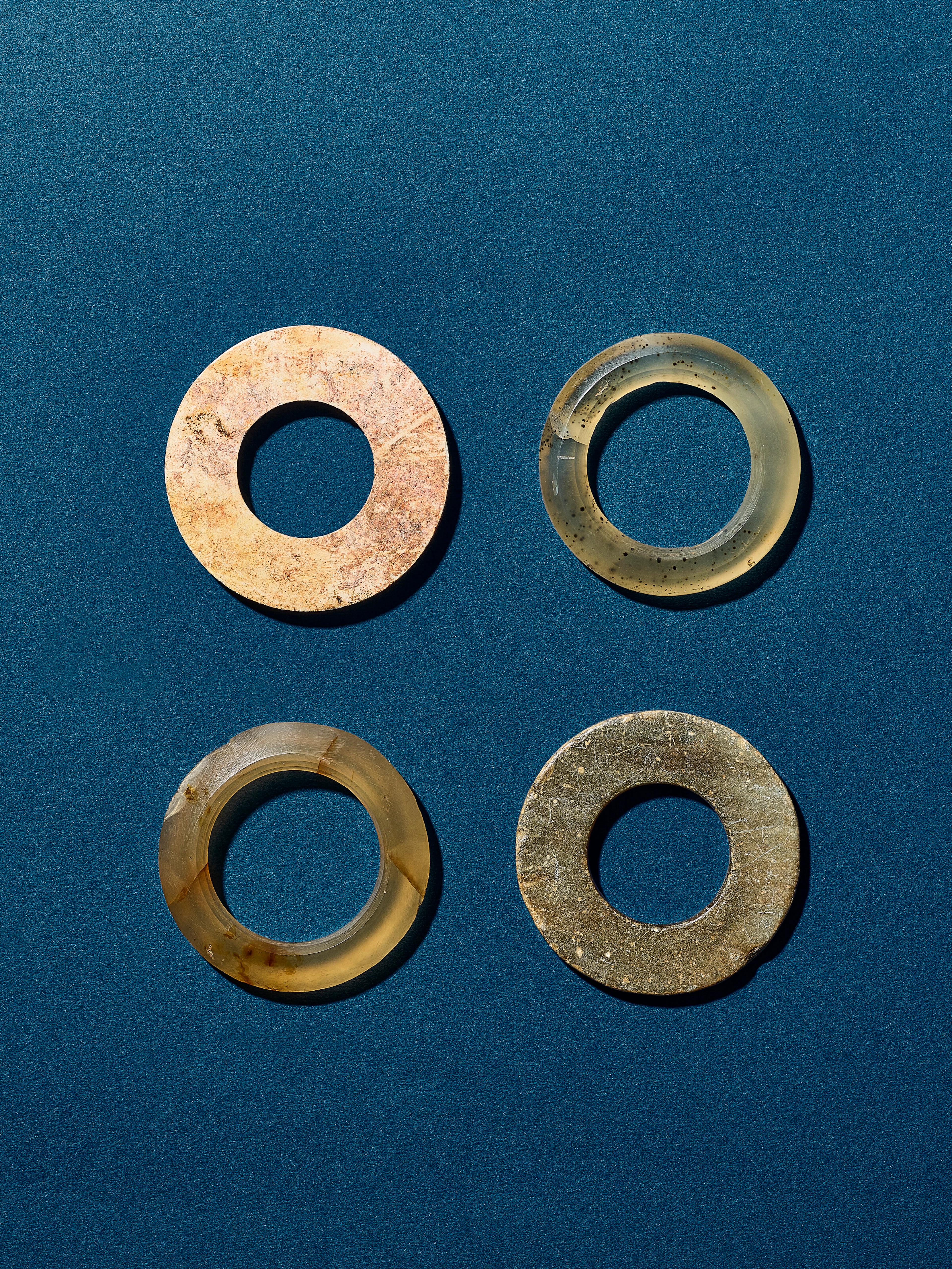 A Group of Two Jade Rings and Two Agate Rings