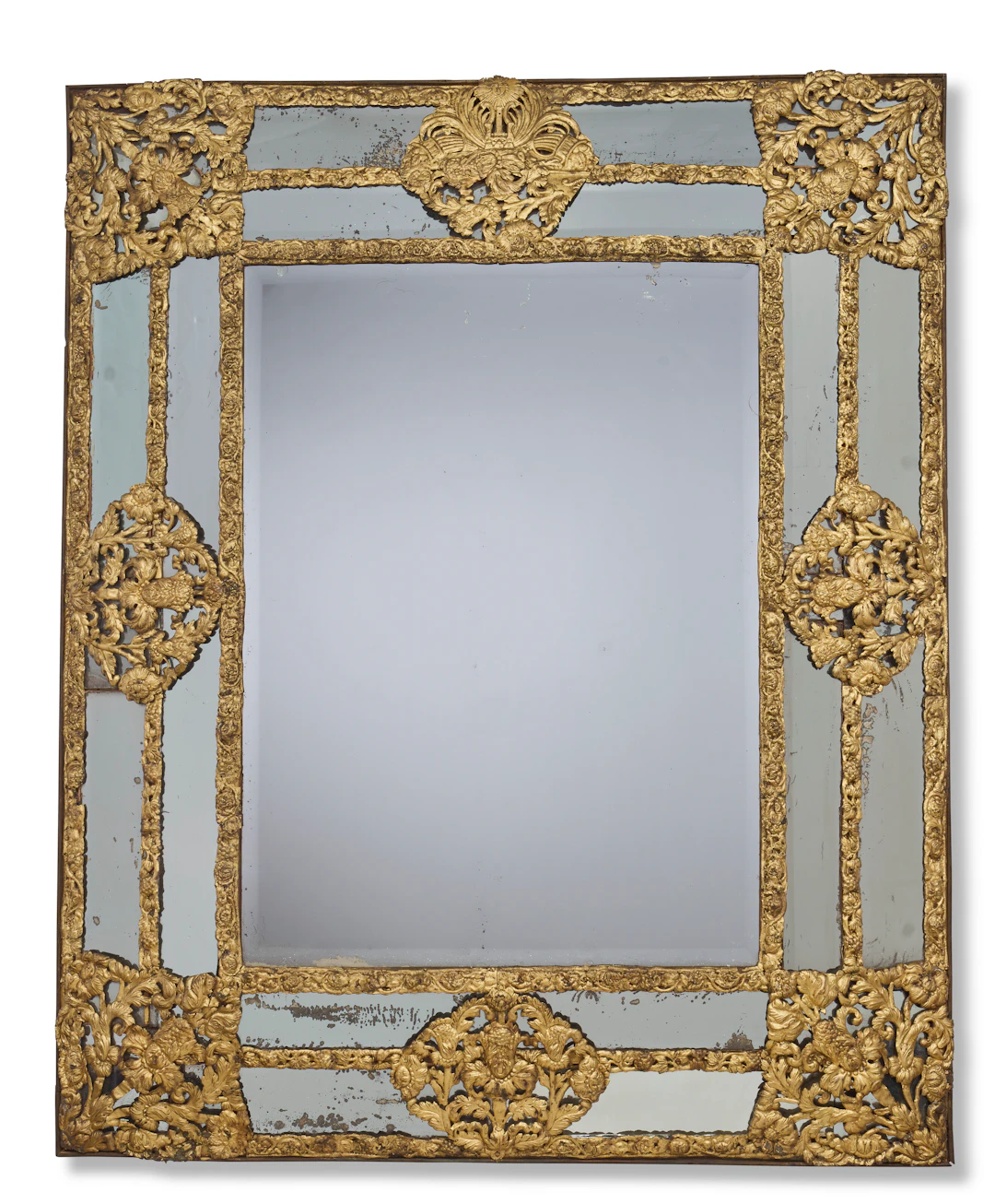 A Flemish Gilt Repousse Metal-Mounted Mirror